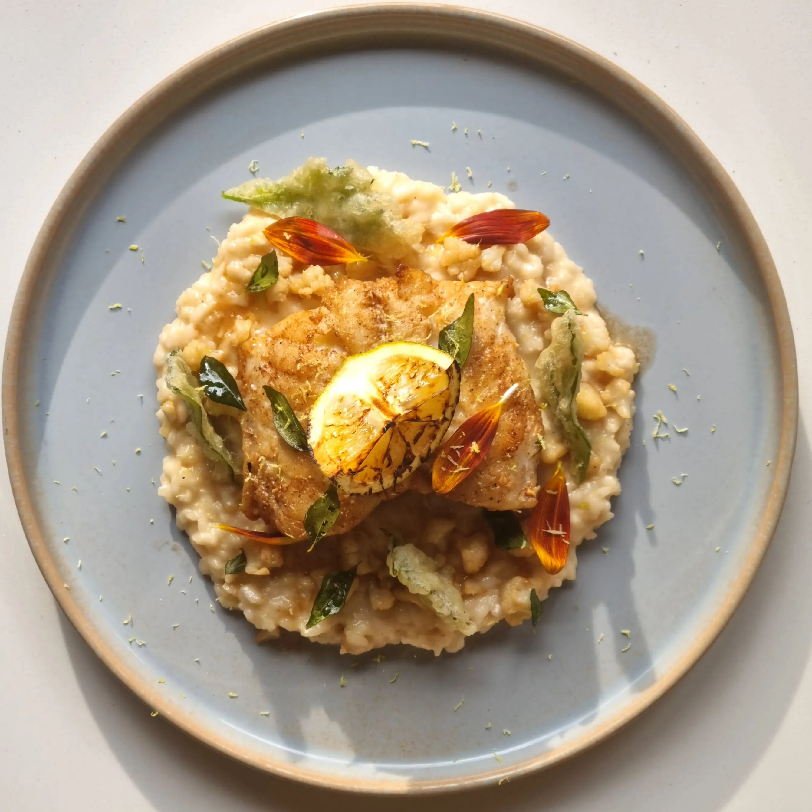 Cauliflower Risotto, Kingklip, Tempura Celery Leaf, Curry Leaf Oil, Lemon Zest1