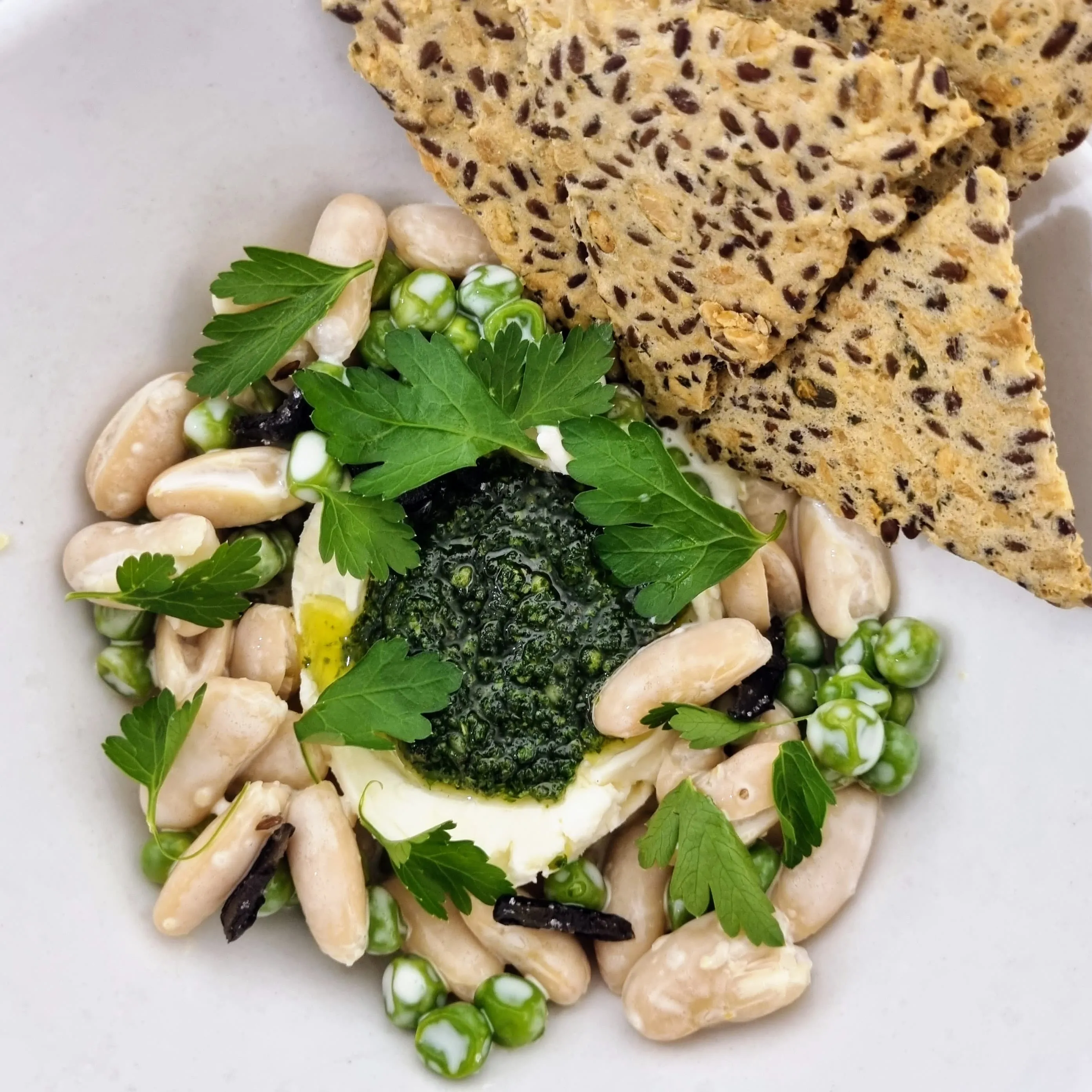 Housemade Ricotta, Peas, Cannelinni, With Lemon Emulsion, Gremolata, Sugared Olives, Seed Crackers
