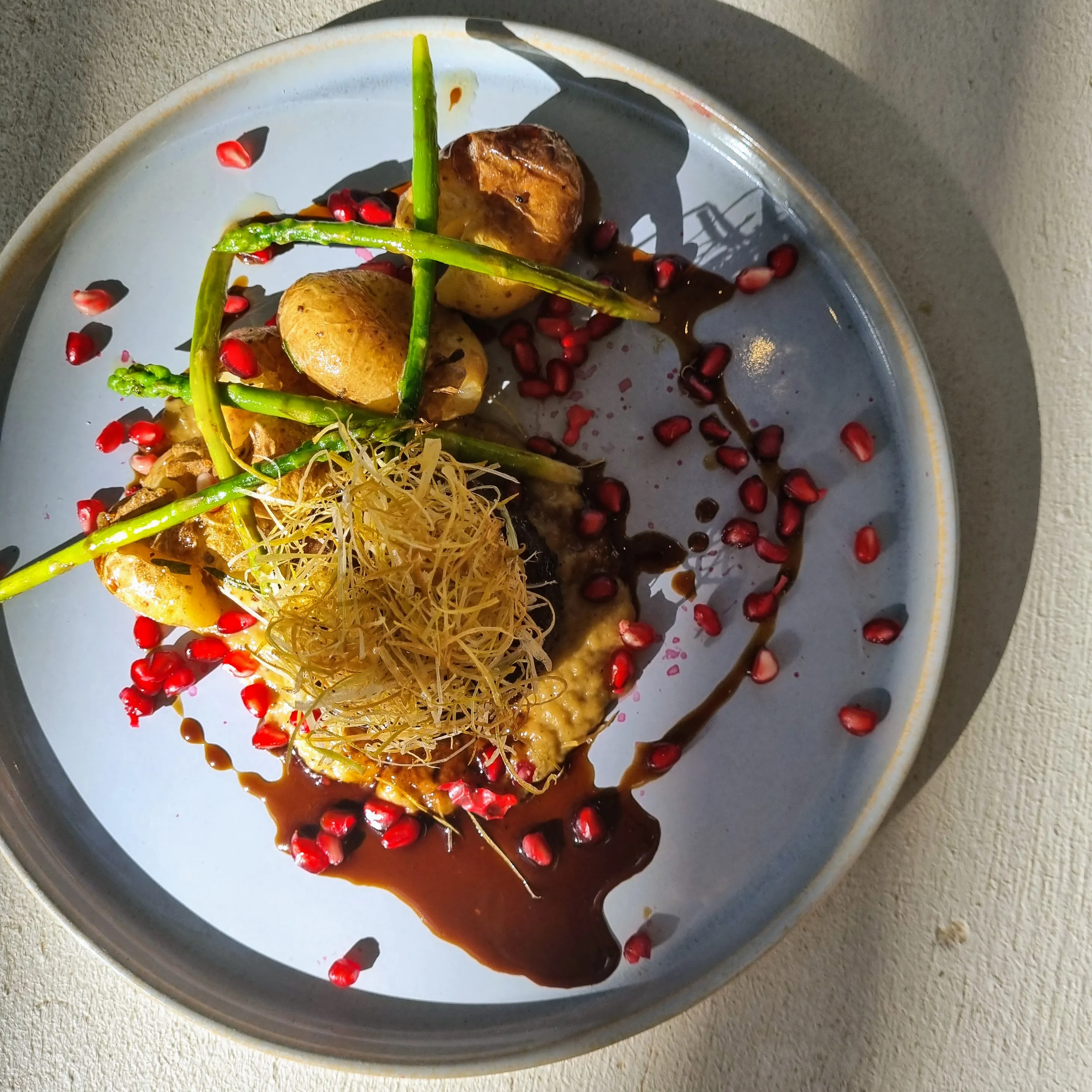 Kudu Loin, Charred Leek Puree, Crushed Baby Potatoes, Pomergranate Jus, Crispy Leek, Asparugus